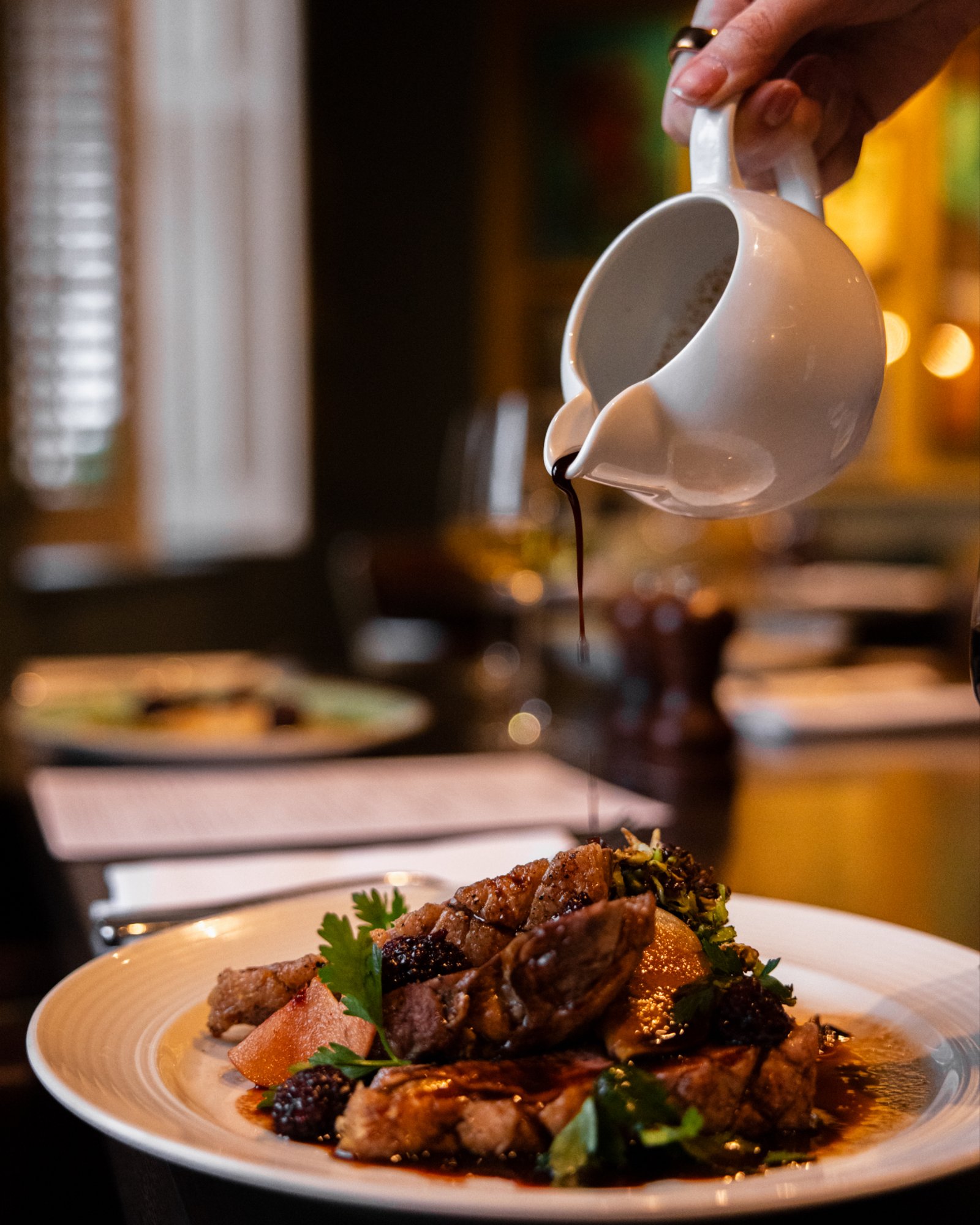 Plated dish with seasonal ingredients at Eighteen Restaurant